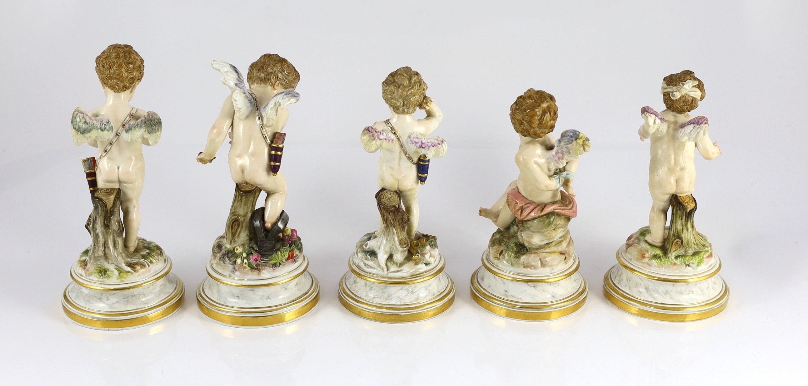 A series of five Meissen porcelain figures of Cupid, late 19th century, modelled by Heinrich Schwabe, 15.5cm - 20cm high, perplexed Cupid restored, Provenance - purchased from Winifred Williams, Eastbourne/London before